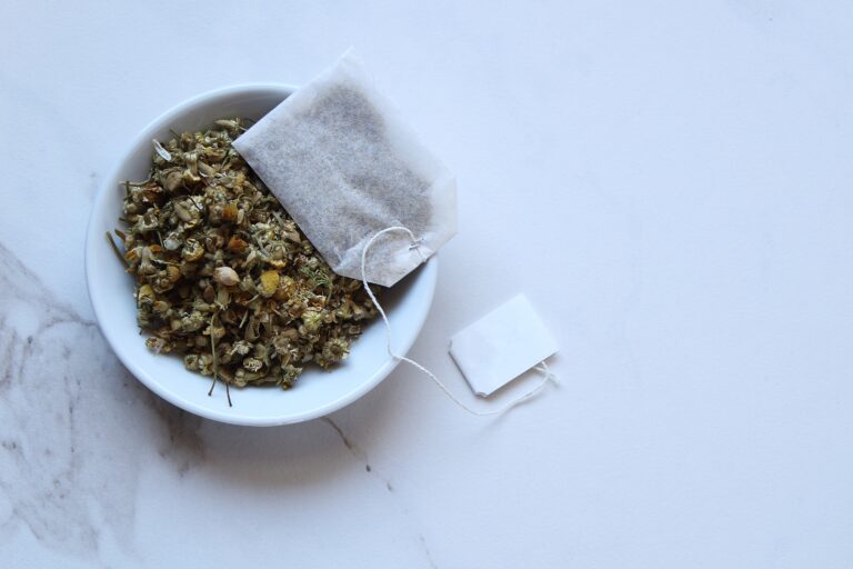 Loose chamomile tea and grab bag with copy space